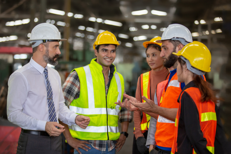Industrial Engineering Team Collaborating in Shipyard
